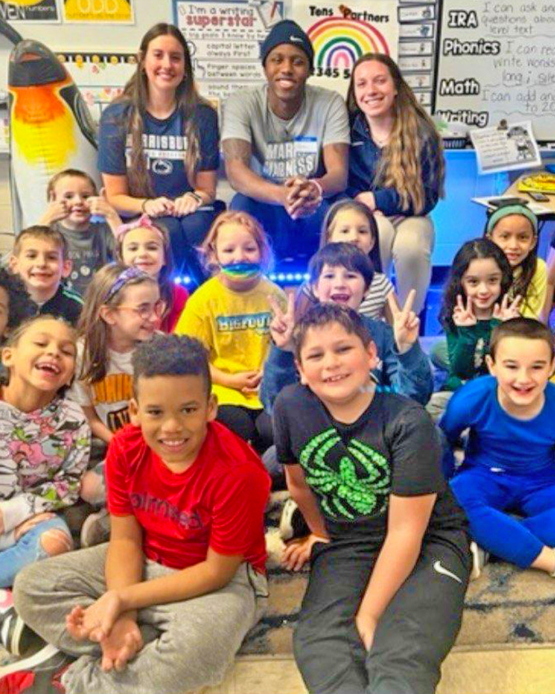 kendis_butler_joins_other_student-athletes_in_reading_to_children_at_an_elementary_school_in_2023