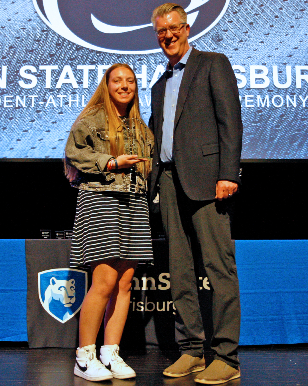 kendis_butler_poses_with_head_coach_ross_patrick_after_being_named_the_school-s_female_athlete_of_the_year_in_2022