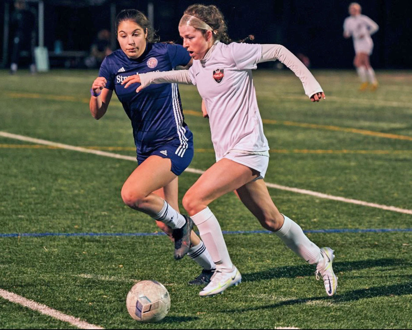 kara slavin fights off a defender while protecting the ball